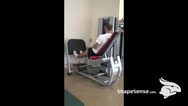 An image of a man performing the leg press machine calf raise exercise.