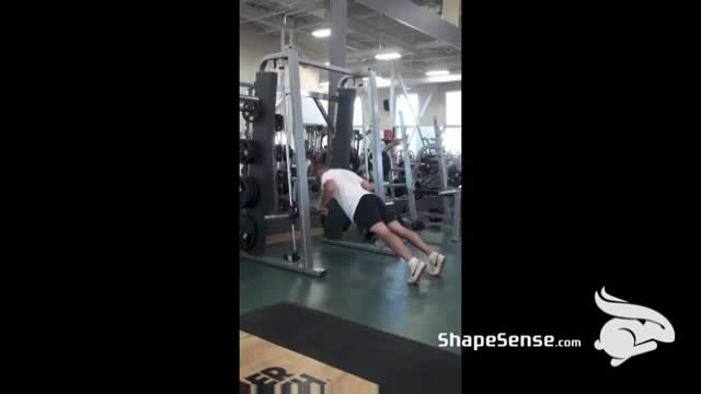 An image of a man performing the incline push up exercise.