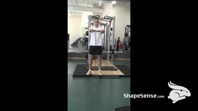 An image of a man performing the wrist roller flexion exercise.