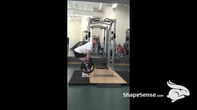 An image of a man performing the romanian deadlift exercise.