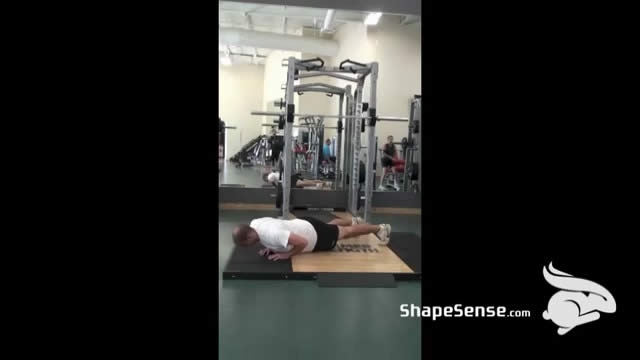 An image of a man performing the close grip push up exercise.