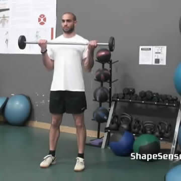 An image of a man performing the barbell curl exercise.