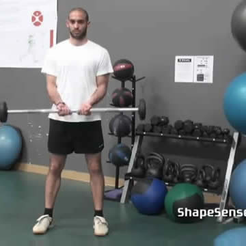 An image of a man performing the close grip barbell curl exercise.