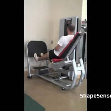 An image of a man performing the leg press machine calf raise exercise.