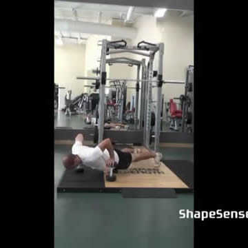 An image of a man performing the depth push up exercise.