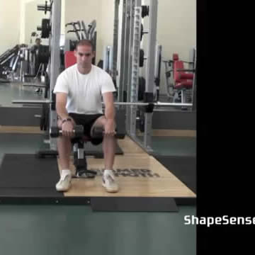 An image of a man performing the reverse dumbbell wrist curl exercise.