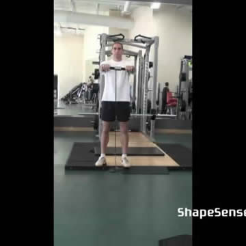 An image of a man performing the wrist roller flexion exercise.