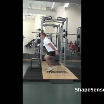 An image of a man performing the box jump exercise.