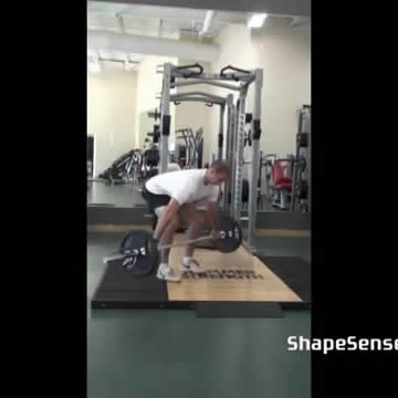 An image of a man performing the snatch grip deadlift exercise.