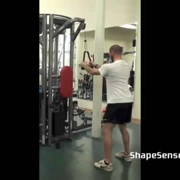 An image of a man performing the rope straight arm pull down exercise.