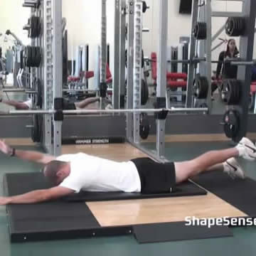 An image of a man performing the contralateral superman exercise.