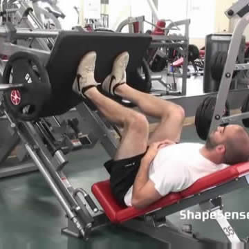 An image of a man performing the leg press exercise.