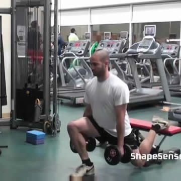 An image of a man performing the one leg dumbbell squat (Bulgarian squat) exercise.