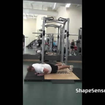 An image of a man performing the close grip push up exercise.