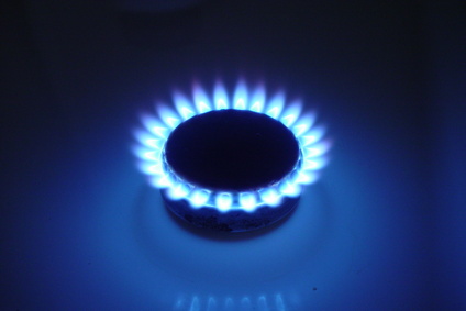 blue flames on an oven burner