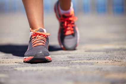 view of some feet walking on the ground