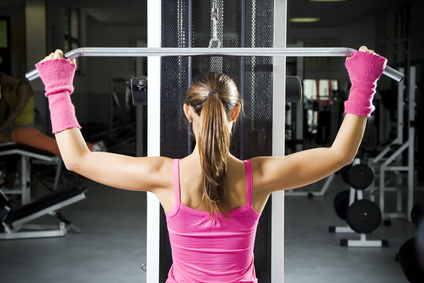 a woman performing lat pulldown exercises