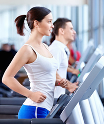 image of a woman walking on a treadmill
